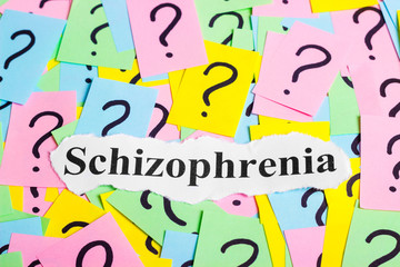 Schizophrenia Syndrome text on colorful sticky notes Against the background of question marks