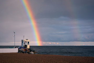 Two rainbows by the sea s