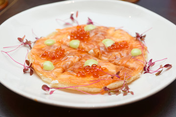 Salmon fillet and roe on Indian roti