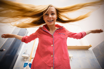 Woman showing her long blonde hair