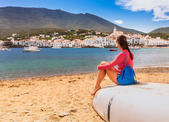 Tourist woman in Cadaques, Catalonia, Spain near of Barcelona. Scenic old town with nice beach and...