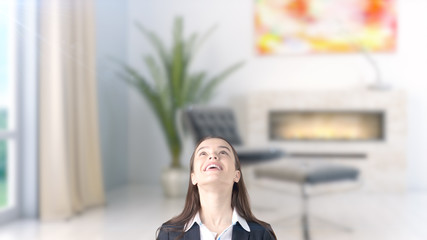 Young beautiful business woman and creative designer standing over blured interior background