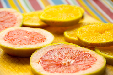 Obraz na płótnie Canvas Grapefruit and orange slices photograph