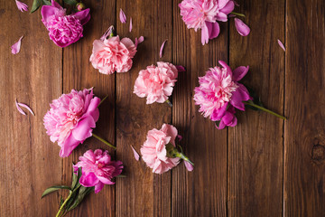 Fototapeta na wymiar Peonies. Pink peonies on a wooden background. Copyspace. Flower photo concept