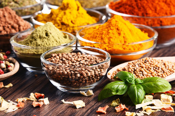 Variety of spices and herbs on kitchen table