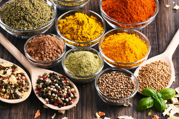 Variety of spices and herbs on kitchen table