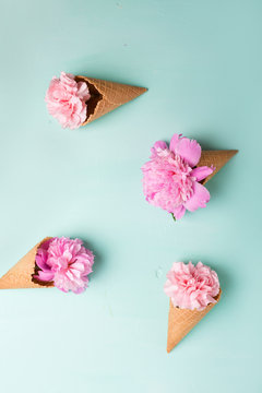 Pink carnations on a blue background. Flowers. Copyspace. Flower photo concept. Flowers in waffle cones, Peonies on a green background. Peonies