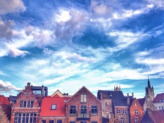 Fototapeta na wymiar Rooftops of the old town in Ghent, Belgium against dramatic sky