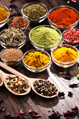 Variety of spices and herbs on kitchen table