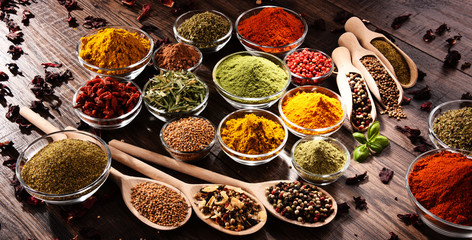 Variety of spices and herbs on kitchen table