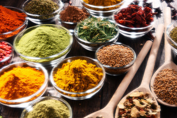 Variety of spices and herbs on kitchen table