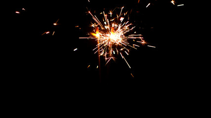 Burning Sparklers in blurred motion. Christmas New Year and Independence Day celebration lights.