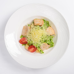 Caesar salad with chicken fillet. White background, menu concept.