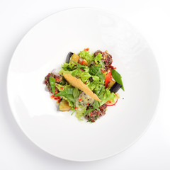 Creative salad with tartar, beef, eggplant. White background, menu concept.