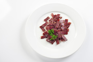 Jerky. Sujuk. Snack to beer. On white background, menu concept.