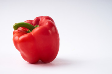 Fresh red bulgarian bell pepper isolated on white background with copy space.