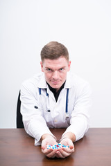 caucasian man doctor holding  medical drug,selective focus