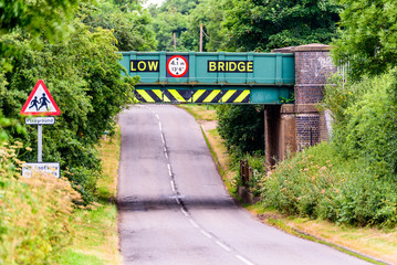 Day view of UK motorway highway under railway bridge