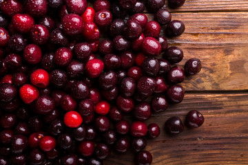 Ripe sweet cherry. Cherry. Cherry on a wooden background