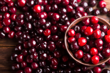 Cherries in a ceramic bowl. Ripe sweet cherry. Cherry. Cherry on a wooden background