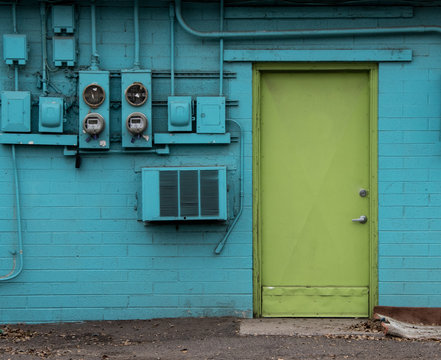 Green Door In Blue House