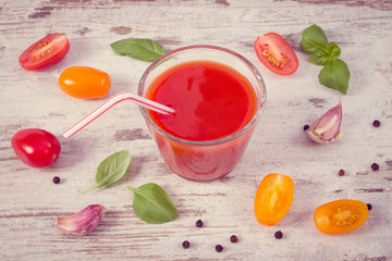 Vintage photo, Tomato juice and vegetables with spices, concept of healthy nutrition