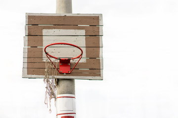 Antic basketball hoop. Basketball backboard with torn net.