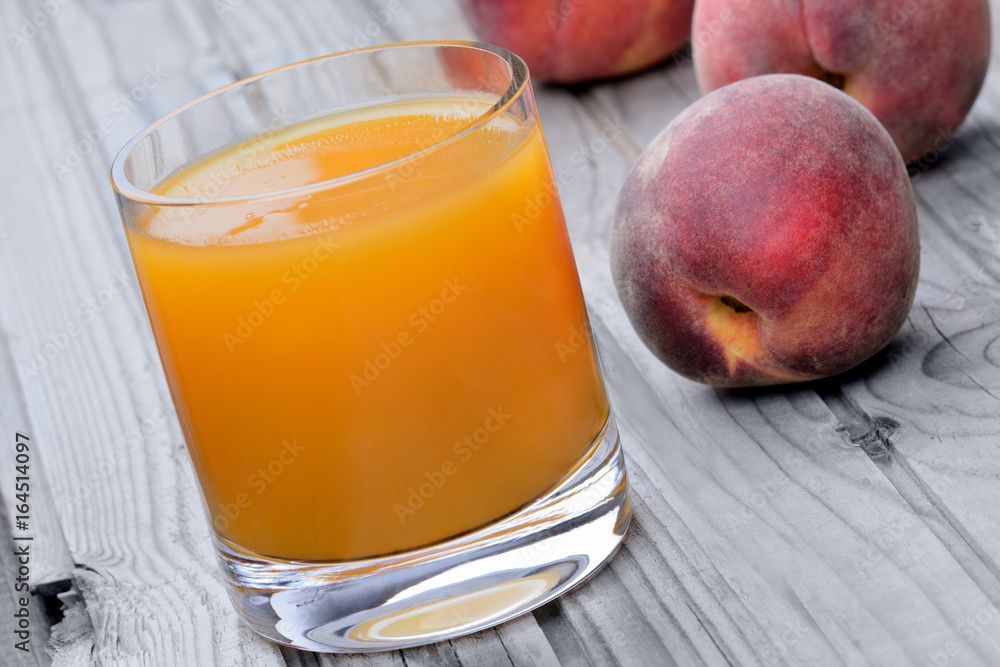 Canvas Prints Peach juice in a glass on table