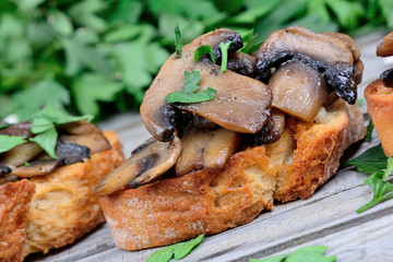 Heap of bruschetta with mushroom garlic and parsley