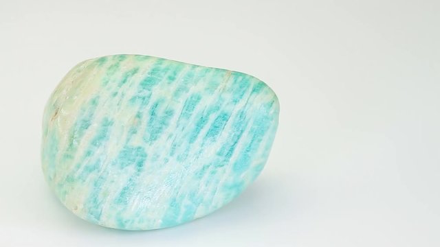 Amazonite or Amazon stone, green mineral  isolated on a white background