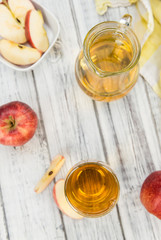 Apple Cider (selective focus) on vintage wooden background