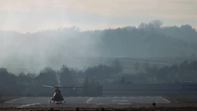 Russian helicopter Mi-17 servicing in Polish Air Force taking off from airport runway.