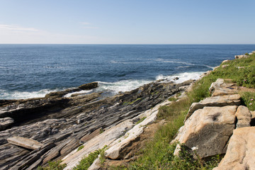 Fototapeta na wymiar Waves Crashing on Rocky Maine Coast