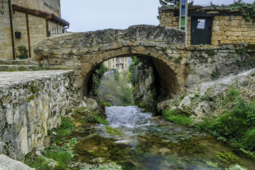 Fototapeta na wymiar medieval bridge in the Tobera town in Burgos, castilla and Leon, Spain.