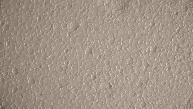 White polystyrene foam surface background texture. Dolly sliding shot 4K ProRes HQ codec