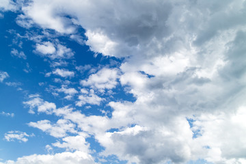 Fototapeta premium A bright blue background of sky and clouds