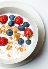 Cereal bowl with fruit healhy breakfast isolated on white