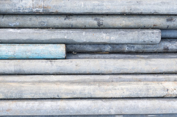 Old grey scaffolding tube pipes with some ends showing