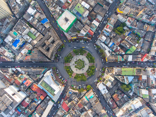 Aerial view, Road roundabout, Expressway with car lots in the city in Thailand.  beautiful Street , downtown, cityscape, Top view. Background