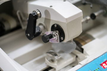 Eye glasses is making by milling machine in workshop