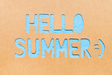 Text Hello Summer on paper with blue background