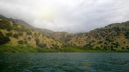 The views of the lake Kournas catamaran in the spring cloudy day
