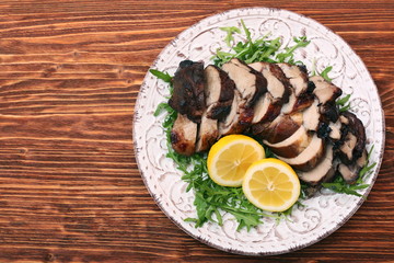 Roast fillet leg of lamb with greens and lemon