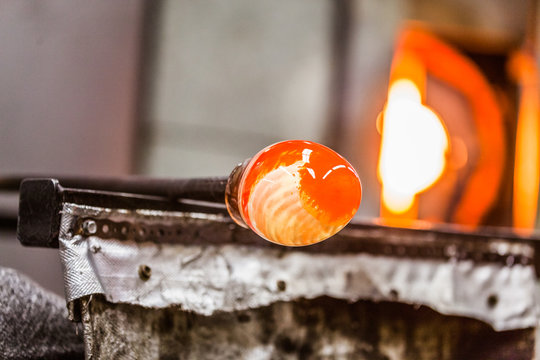 Glassblowing Piece and Furnace in Background