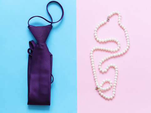 Men Vs. Women.Tie For Man And Pearl Necklace For Woman