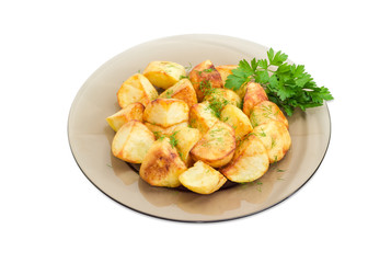 Fried potatoes on the dark glass dish