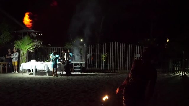 Fire breathing guy on beach in Philippines