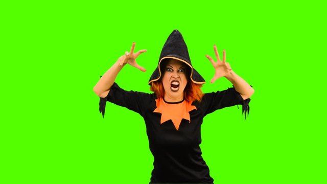 The witch frightens the viewer greenscreen  shot with alpha channel 
