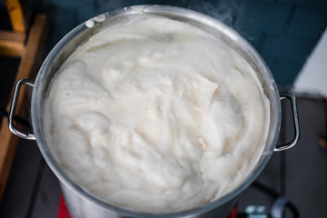 Homebrewing Hot Break and lot of Protein Froth on to of the Boil Kettle Warming up.