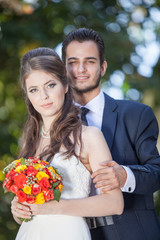 Just married husband and wife taking wedding photo. Happy people